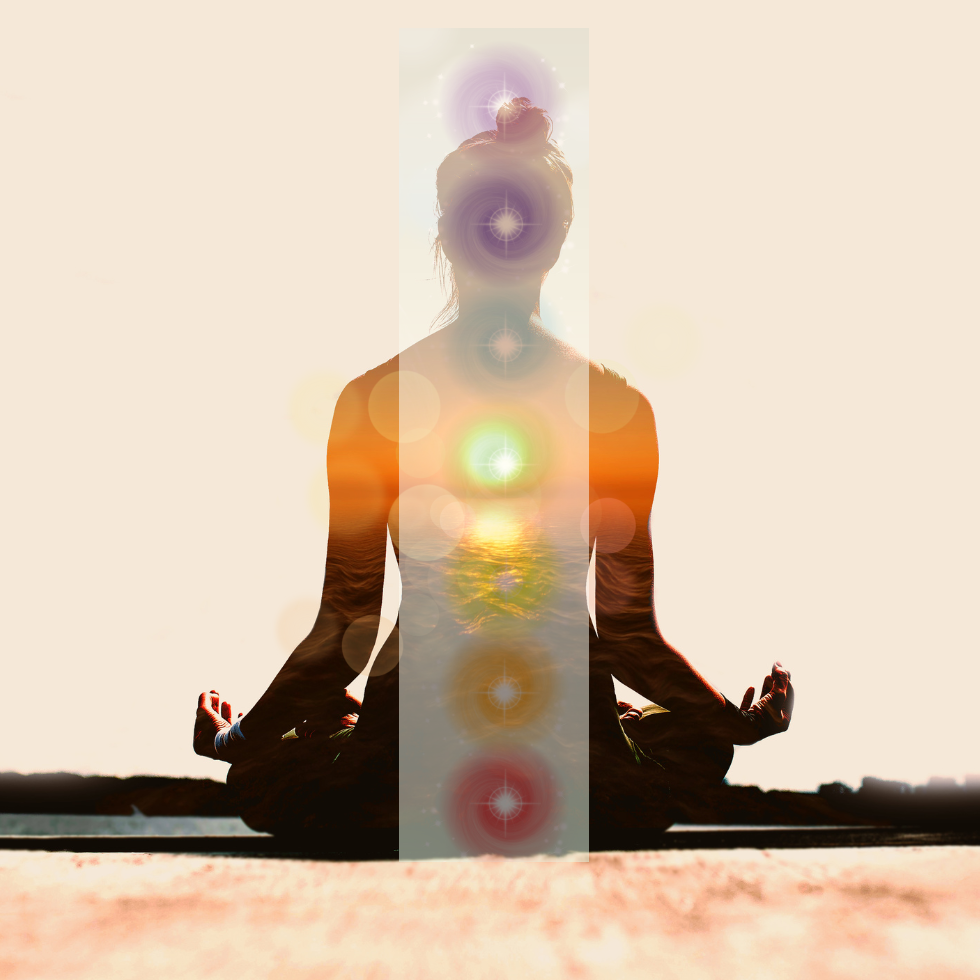 A person meditating showing the seven main chakra system for energy medicine.